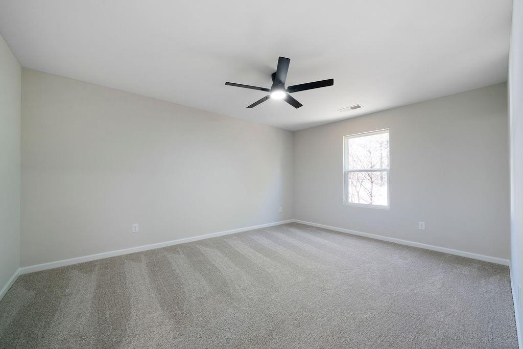 21 Walton Creek Drive Southwest Rome, GA 30165 - Photo 14 of 26 an empty room with a window and a fan
