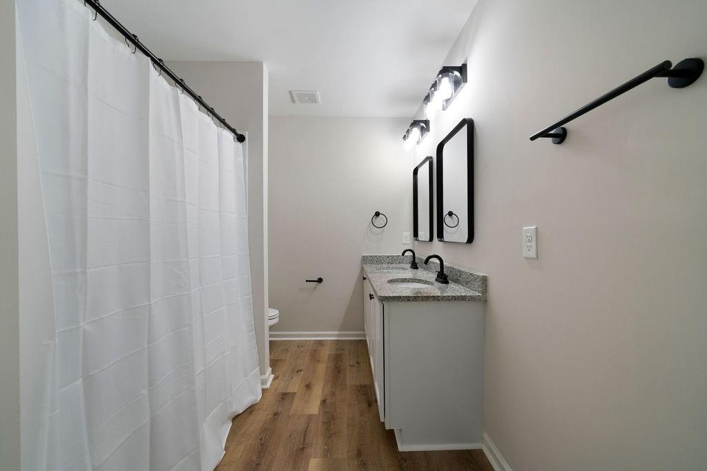21 Walton Creek Drive Southwest Rome, GA 30165 - Photo 16 of 26 a en suite bathroom with a sink and mirror