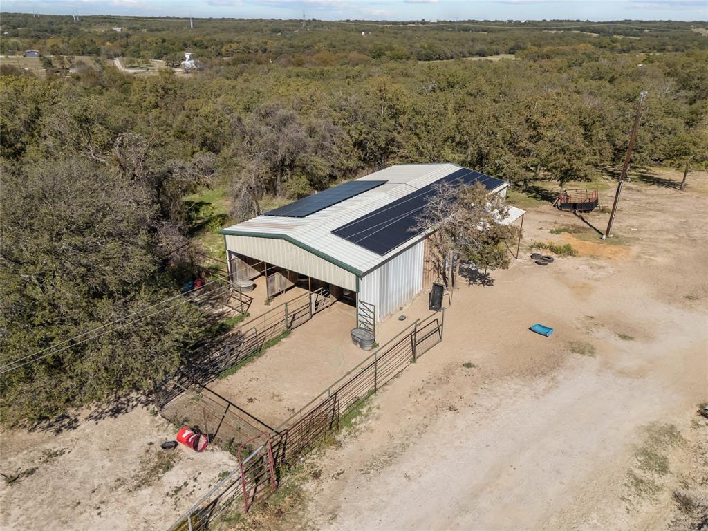 262 North Cheyenne Springtown, TX 76082 - Photo 25 of 35 Drone / aerial view of a heavily wooded area