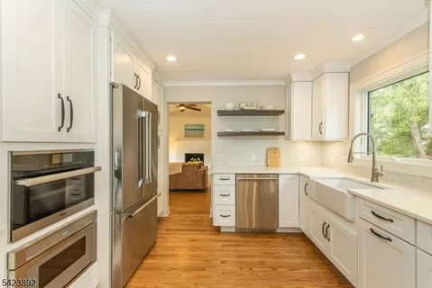 a kitchen with a sink stove and refrigerator