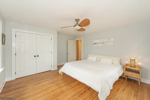 a bedroom with a bed and cabinets