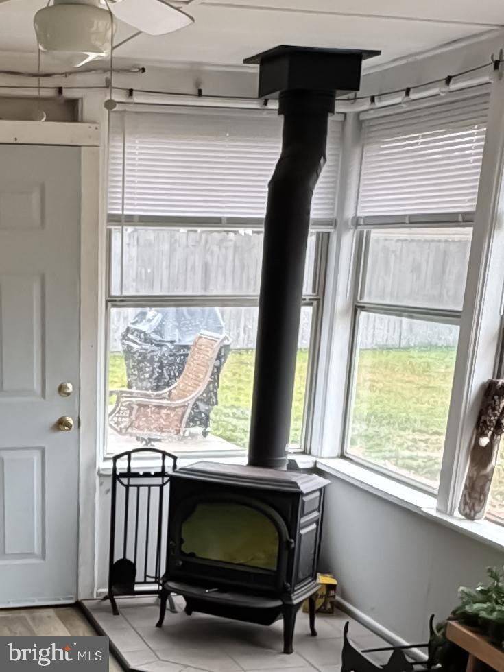802 Dunbury Road Fairless Hills, PA 19030 - Photo 11 of 27 Wood Stove in Sunroom