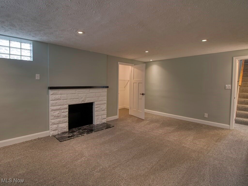 5840 Pearl Road Cleveland, OH 44130 - Photo 28 of 39 Recreation room in basement with fresh carpet, decorative fireplace and closet