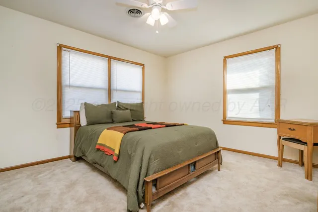 a bathroom with a sink mirror and toilet