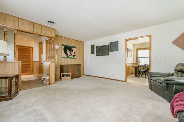 a view of livingroom with furniture and a flat screen tv