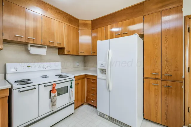 a view of a refrigerator and window