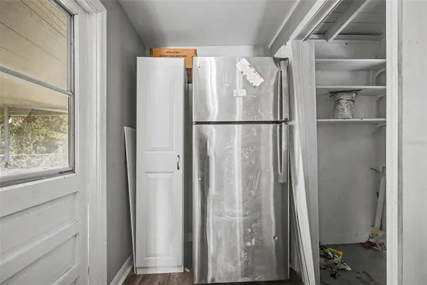 a refrigerator freezer sitting inside of a kitchen