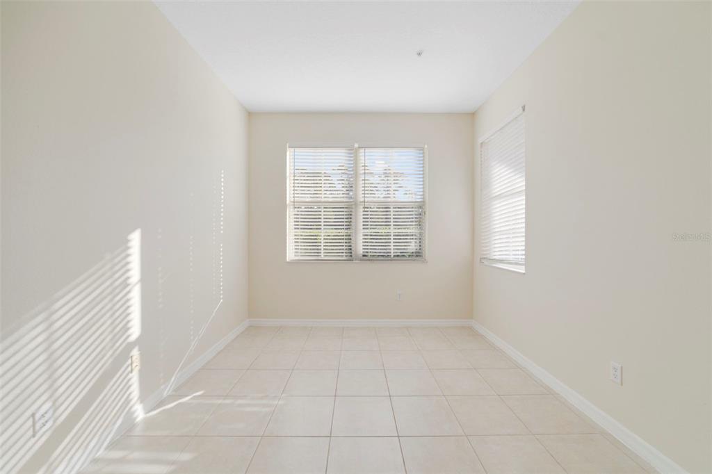 851 Assembly Court Kissimmee, FL 34747 - Photo 11 of 27 an empty room with windows