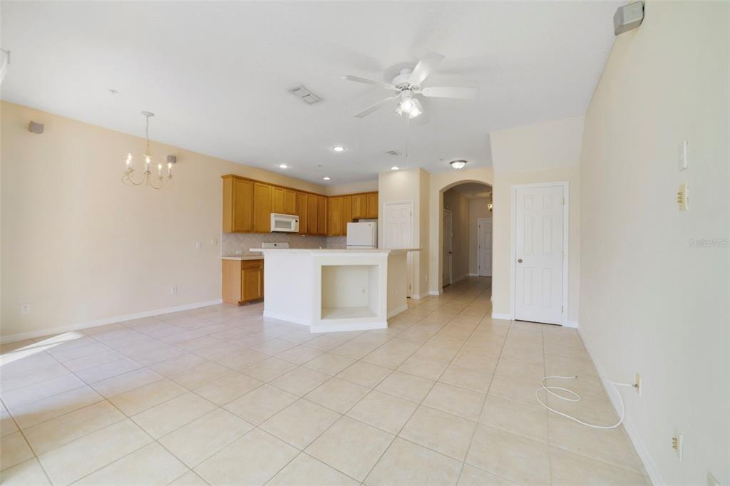 851 Assembly Court Kissimmee, FL 34747 - Photo 12 of 27 a view of a kitchen with a sink and a refrigerator