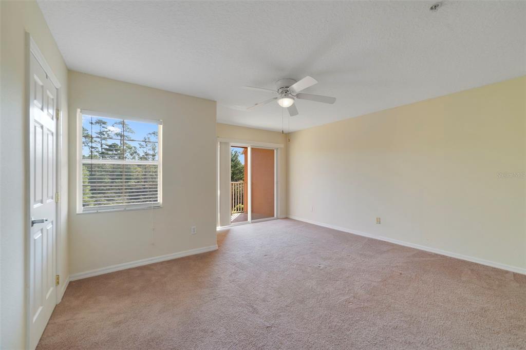 851 Assembly Court Kissimmee, FL 34747 - Photo 16 of 27 a view of an empty room with a window