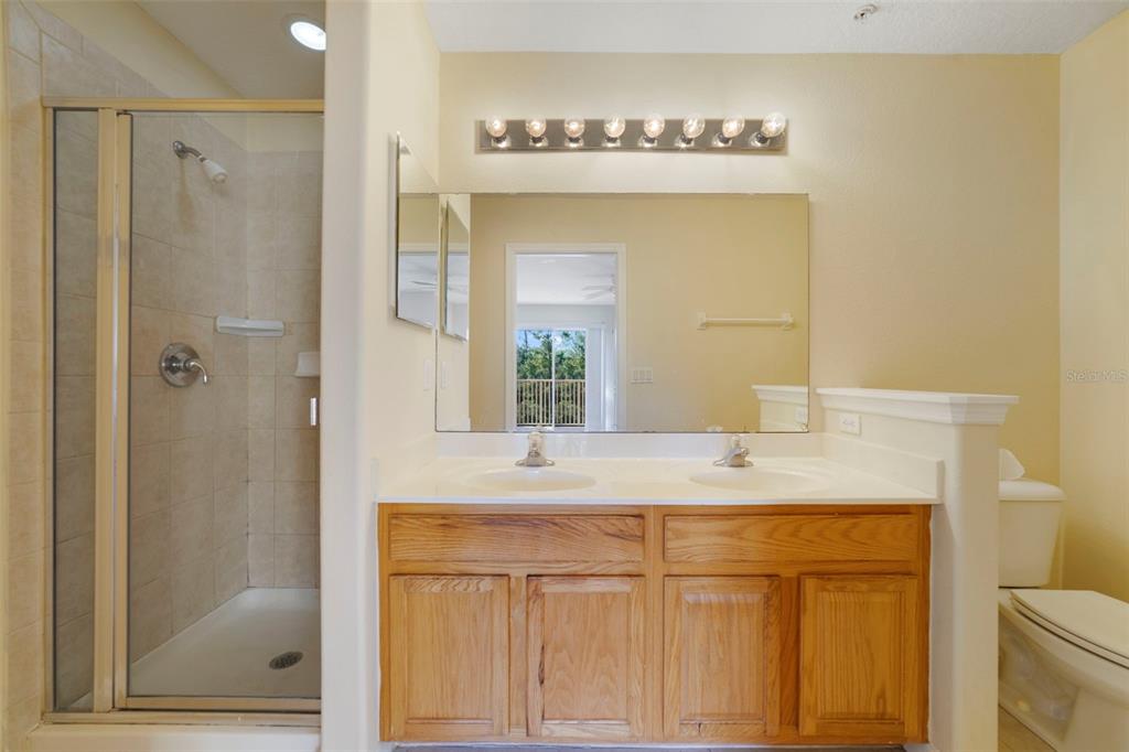 851 Assembly Court Kissimmee, FL 34747 - Photo 20 of 27 a bathroom with a sink and a mirror