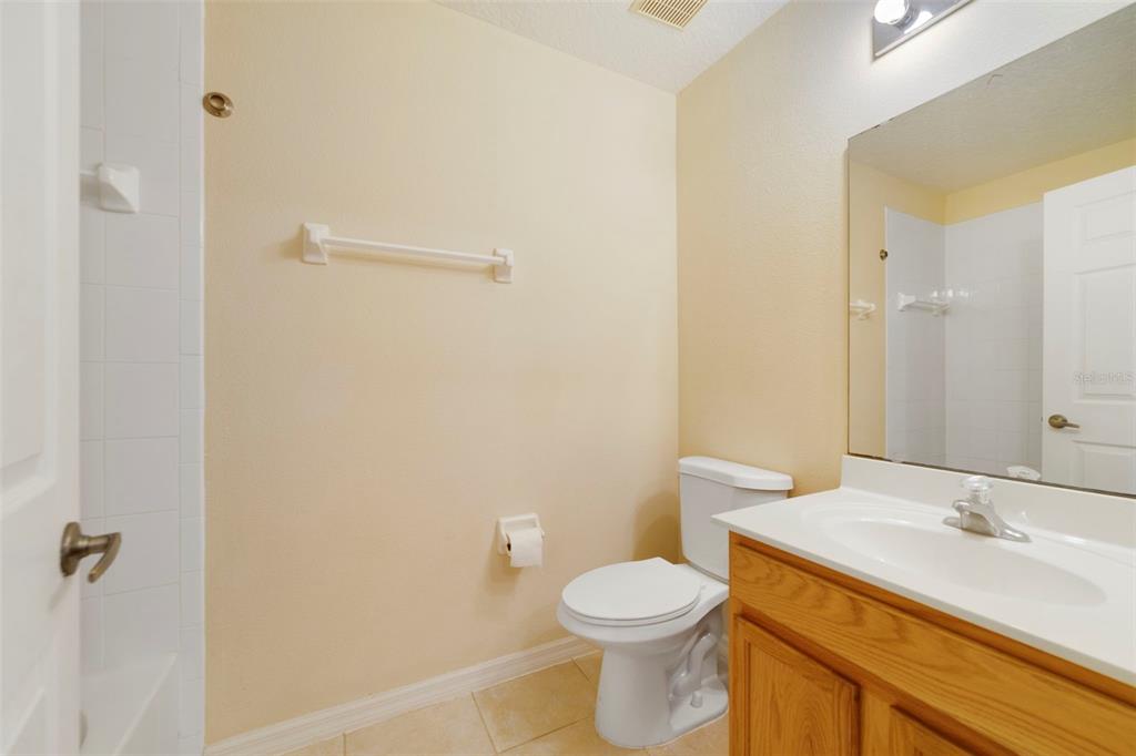 851 Assembly Court Kissimmee, FL 34747 - Photo 22 of 27 a bathroom with a sink and a toilet