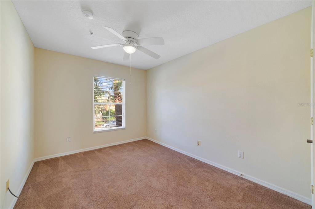 851 Assembly Court Kissimmee, FL 34747 - Photo 25 of 27 an empty room with windows and fan