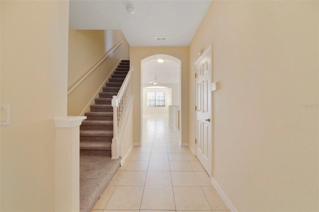 851 Assembly Court Kissimmee, FL 34747 - Photo 3 of 27 a view of entryway and hall with a front door