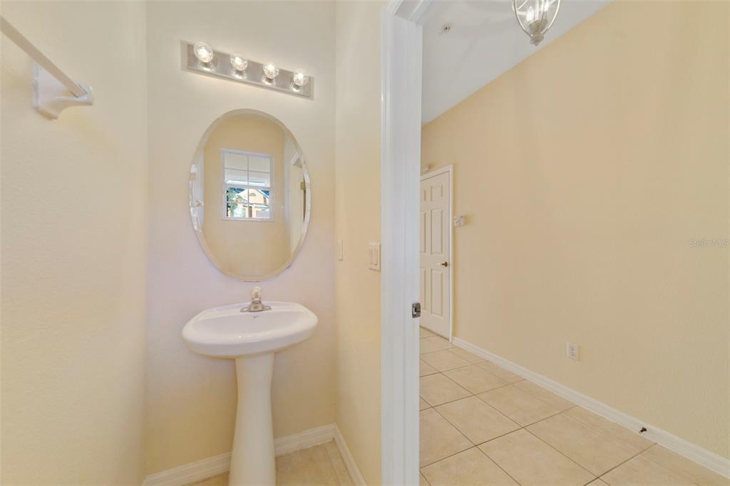 851 Assembly Court Kissimmee, FL 34747 - Photo 4 of 27 a bathroom with a sink and a mirror