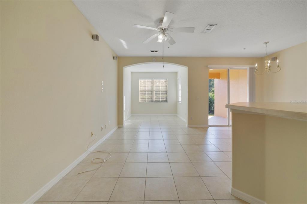 851 Assembly Court Kissimmee, FL 34747 - Photo 5 of 27 wooden floor in an empty room with a window