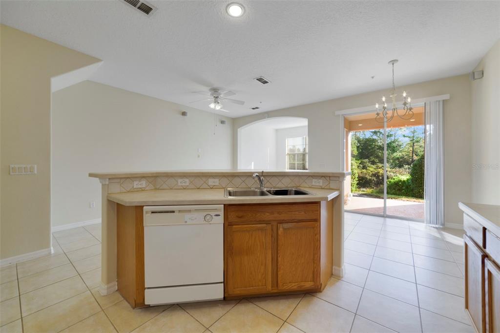 851 Assembly Court Kissimmee, FL 34747 - Photo 7 of 27 a kitchen with a stove and a sink