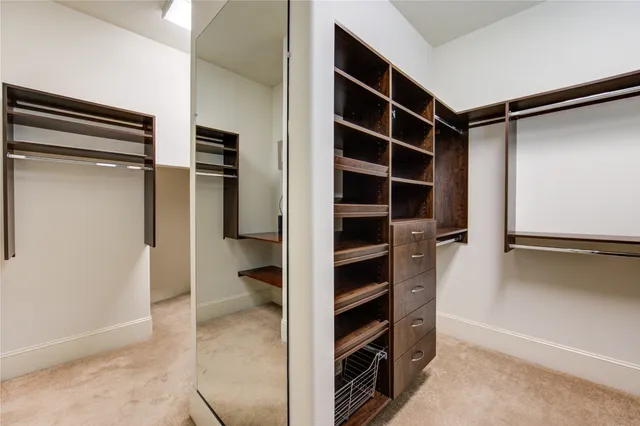 a bathroom with a granite countertop sink toilet a mirror and shower