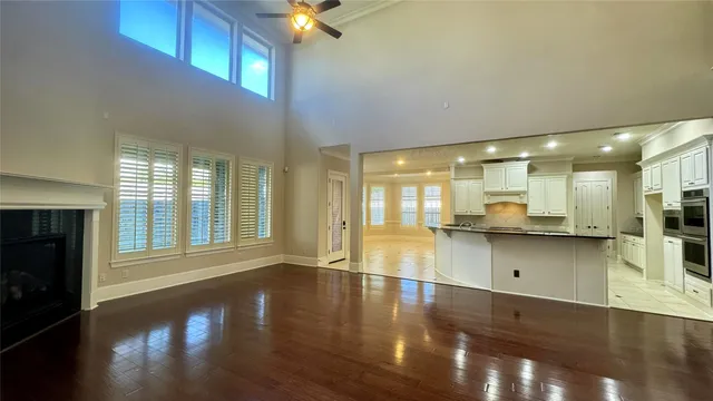 a view of a kitchen with a sink and cabinets