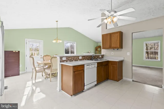 a kitchen with a refrigerator and a sink