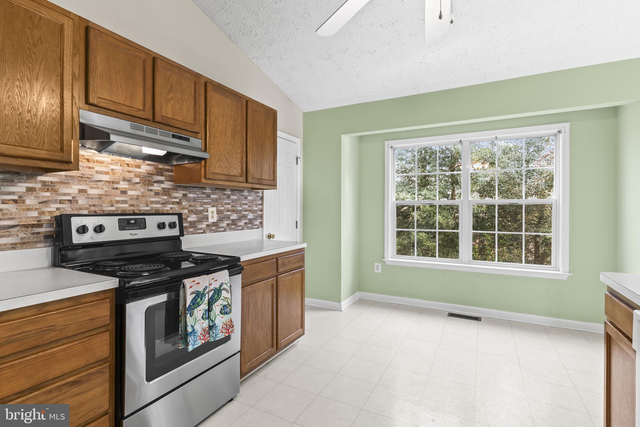 9400 Penns Hill Road La Plata, MD 20646 - Photo 14 of 39 a kitchen with stainless steel appliances granite countertop a stove a sink and a microwave