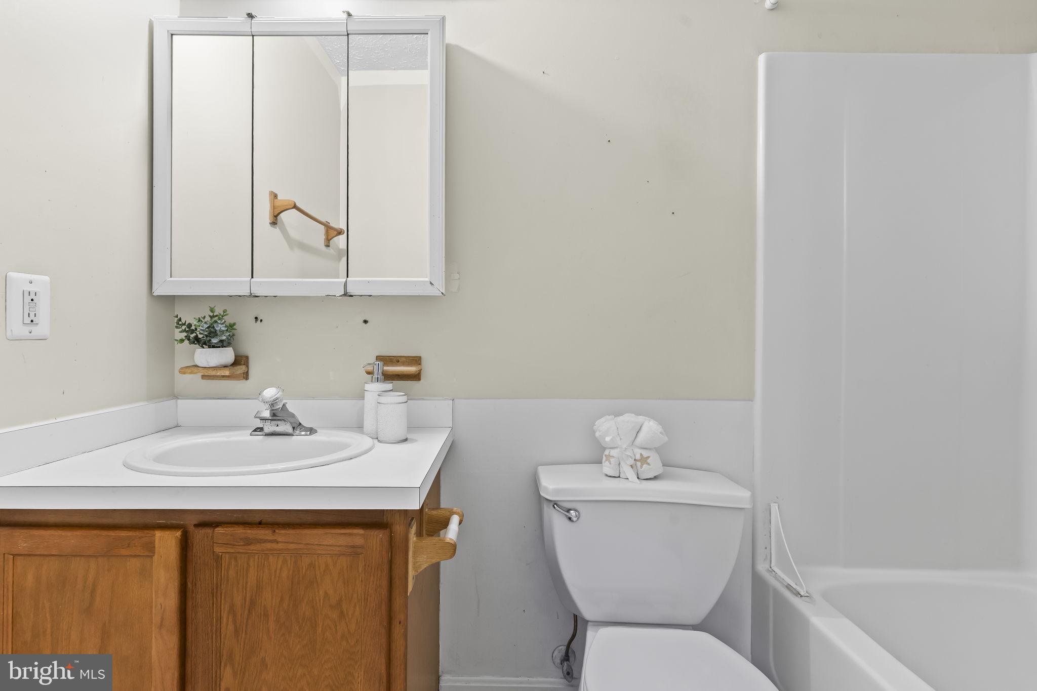9400 Penns Hill Road La Plata, MD 20646 - Photo 17 of 39 a bathroom with a sink a toilet and a mirror