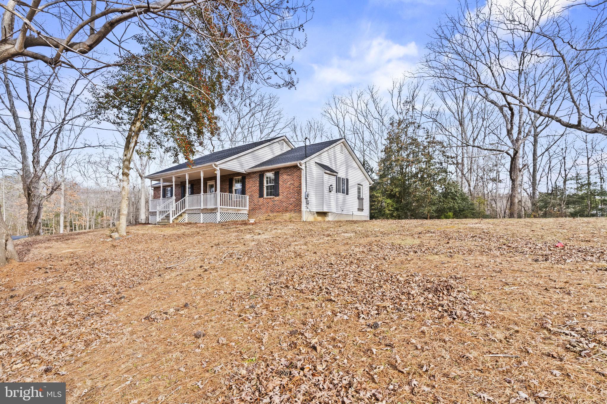 9400 Penns Hill Road La Plata, MD 20646 - Photo 2 of 39 a house with trees in the background