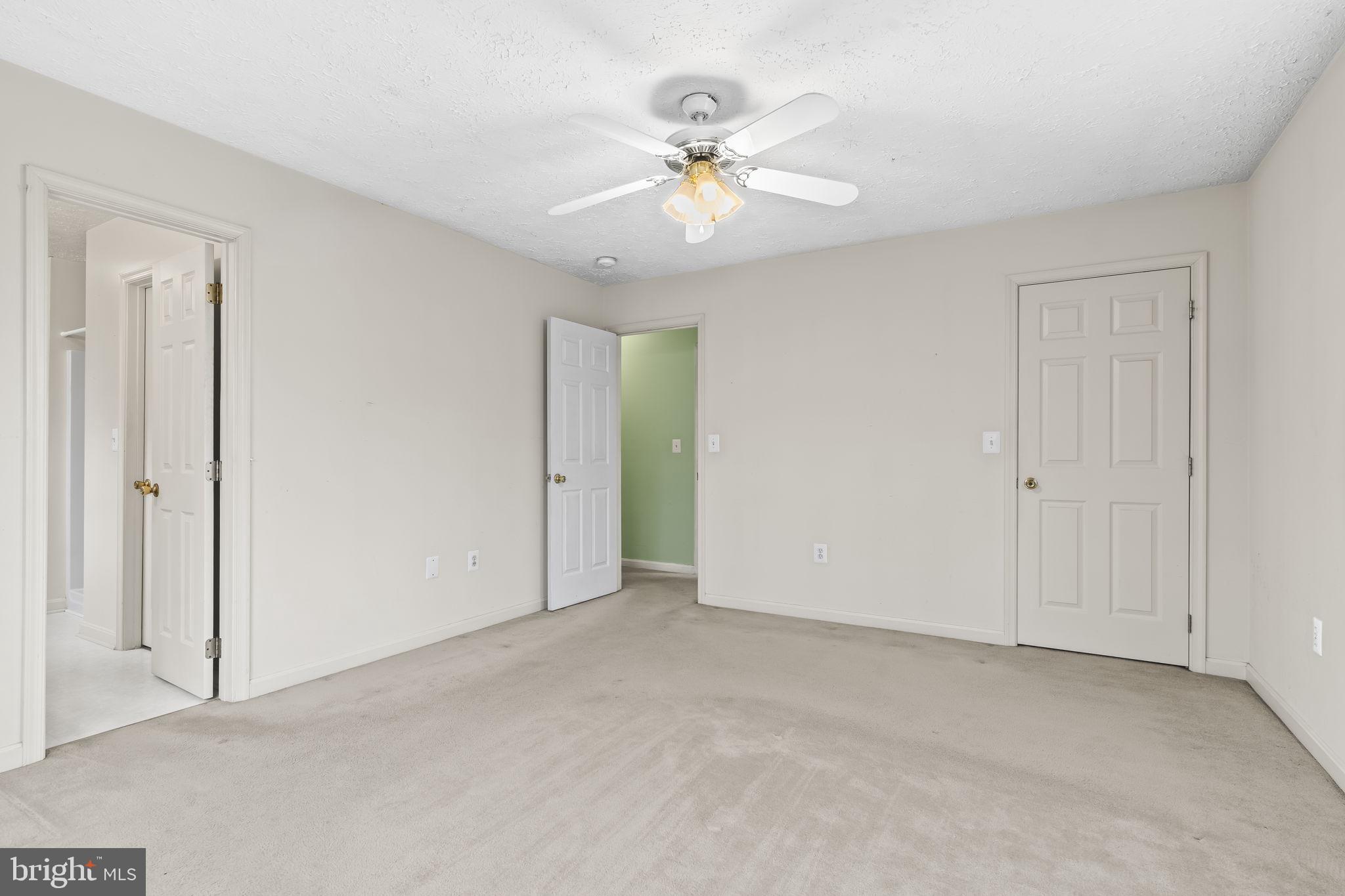 9400 Penns Hill Road La Plata, MD 20646 - Photo 21 of 39 a view of an empty room with a ceiling fan