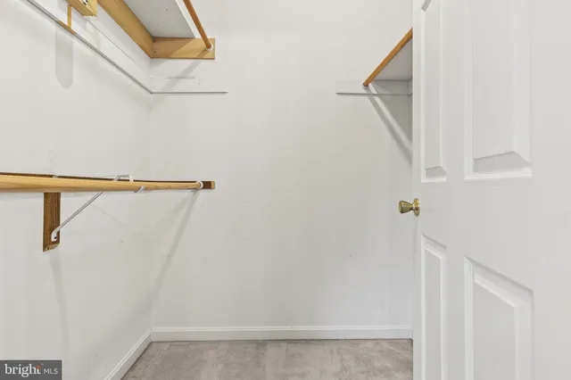 a bathroom with a sink vanity mirror and toilet