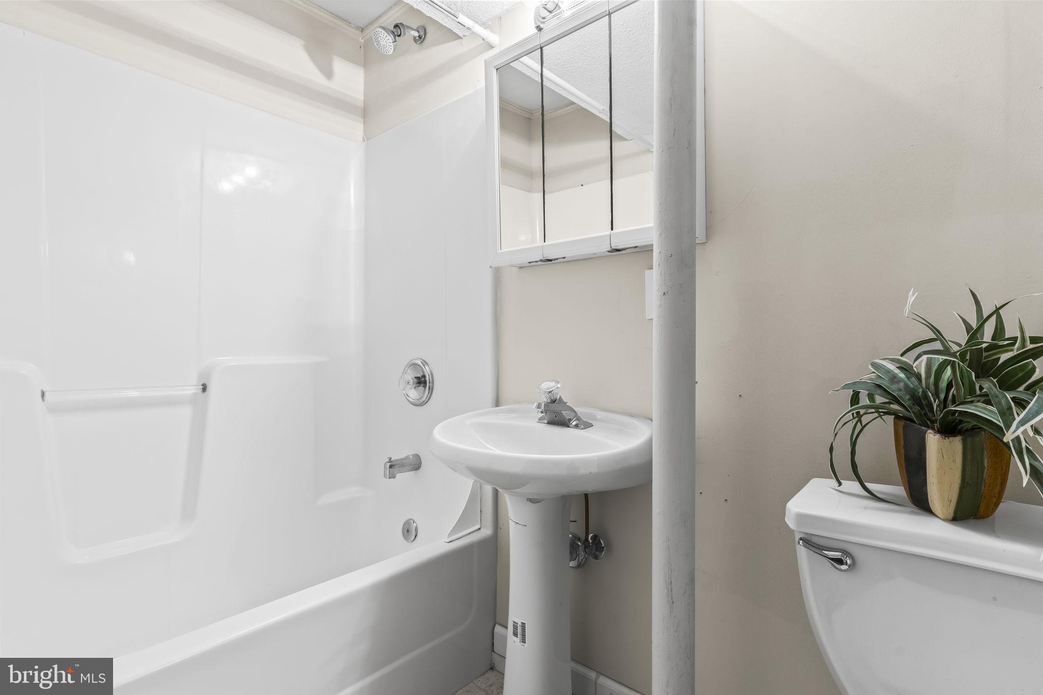 9400 Penns Hill Road La Plata, MD 20646 - Photo 28 of 39 a bathroom with a sink a toilet and shower