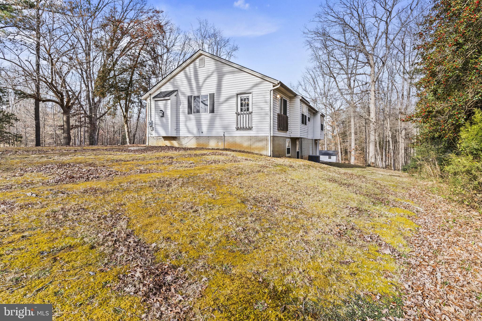 9400 Penns Hill Road La Plata, MD 20646 - Photo 36 of 39 a view of a large house with a large tree and a yard