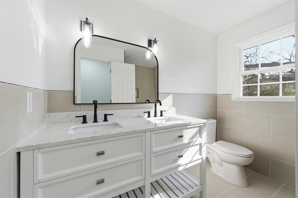 130 Malone Drive Rome, GA 30165 - Photo 19 of 45 a bathroom with a toilet a sink and mirror