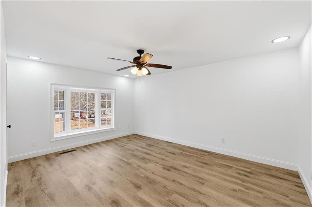 130 Malone Drive Rome, GA 30165 - Photo 21 of 45 a view of empty room with wooden floor and fan