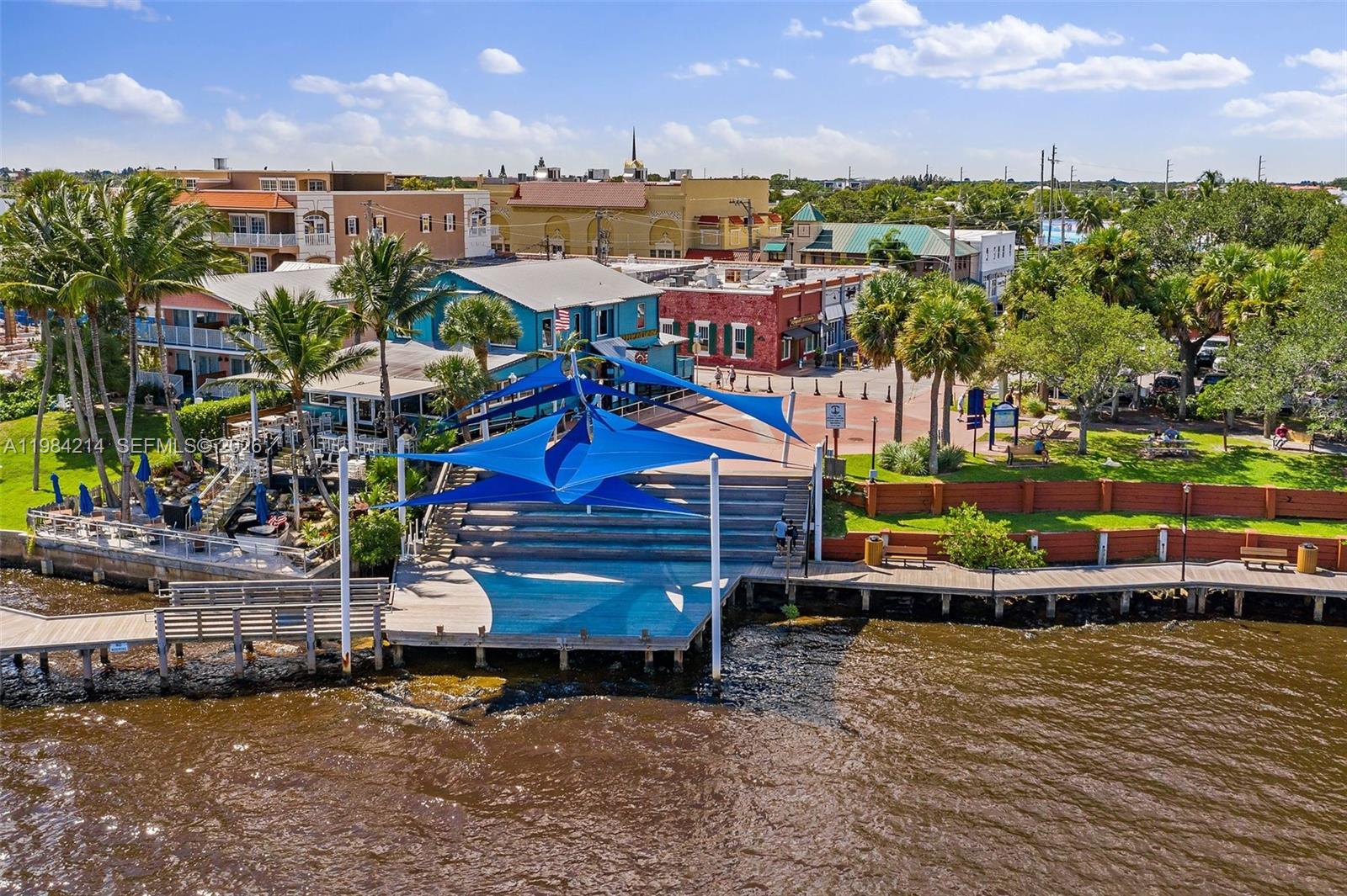 669 Northeast Plantation Road, Unit 406 Stuart, FL 34996 - Photo 40 of 41 a view of a city with lots of trees