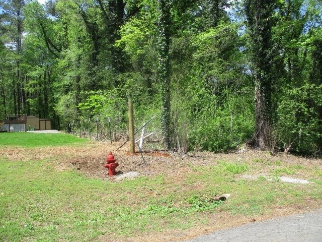 0 Honeycomb Road Grant, AL 35747 - Photo 5 of 8 a backyard of a house with table and chairs