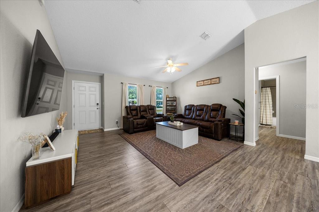 13 Teak Loop Place Ocala, FL 34472 - Photo 32 of 36 a living room with furniture and a flat screen tv