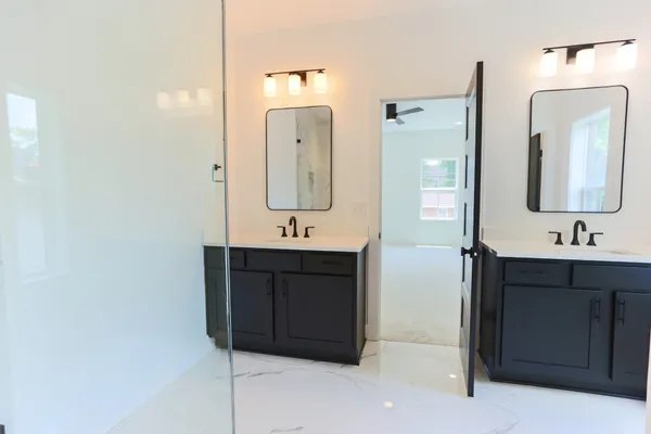 a bathroom with a sink vanity and mirror