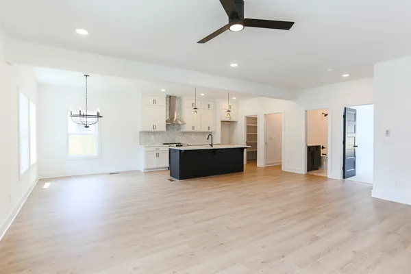 a view of a kitchen with a sink and a refrigerator