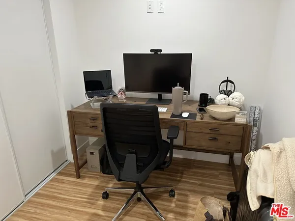 a view of a workspace with furniture