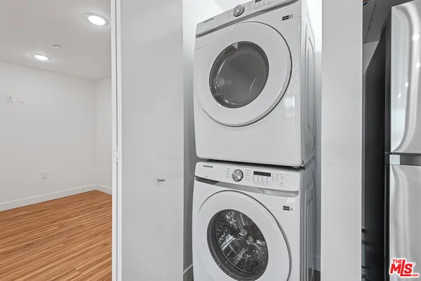 a view of a hallway with washer and dryer