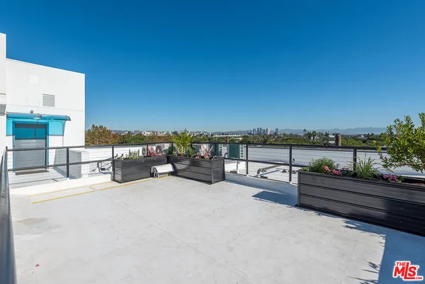 a view of a terrace with seating area