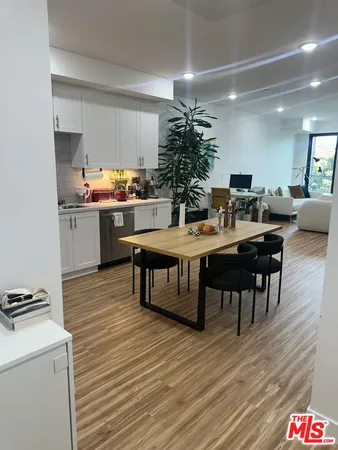 a kitchen with a table and chairs in it