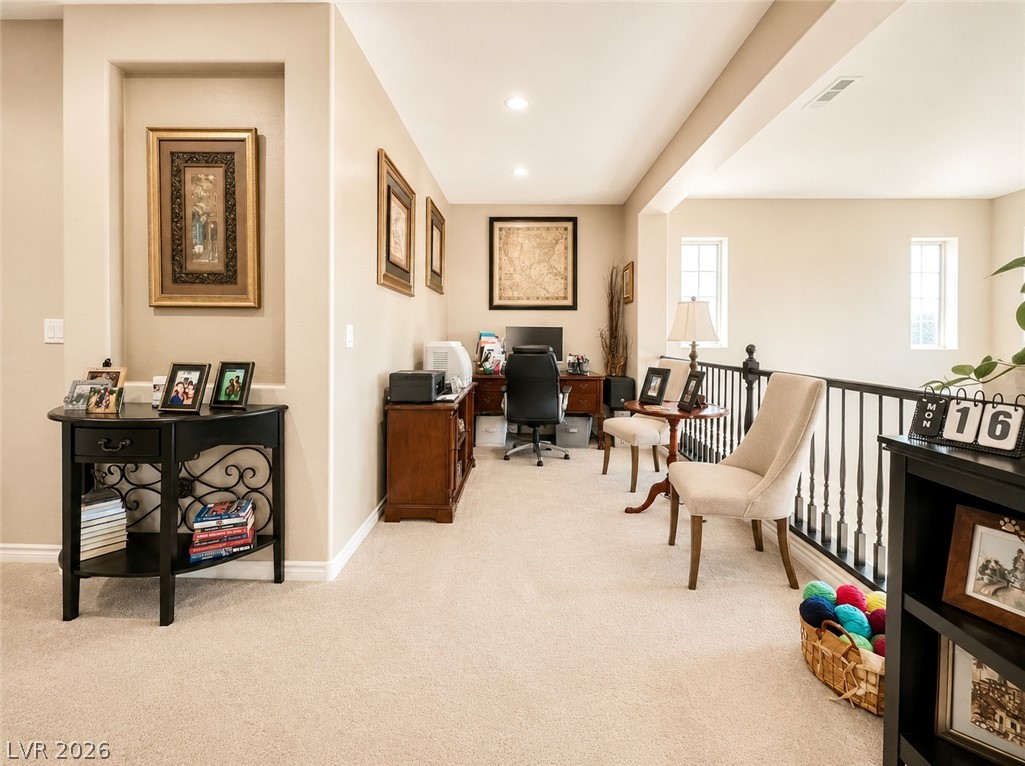 9724 University Ridge Avenue Las Vegas, NV 89149 - Photo 44 of 61 A versatile open loft space, perfect for a home office or additional living area, overlooks the lower level.