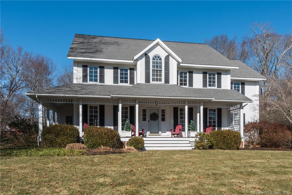 32 Spring Rock Road East Lyme, CT 06333 - Photo 1 of 1 a view of a white house with large windows and a yard in front of it