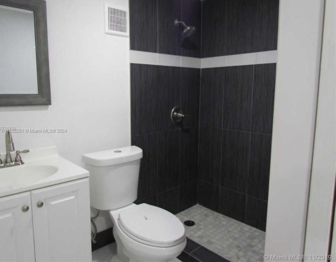 6111 Southwest 39th Street Miramar, FL 33023 - Photo 5 of 8 a bathroom with a sink and a toilet