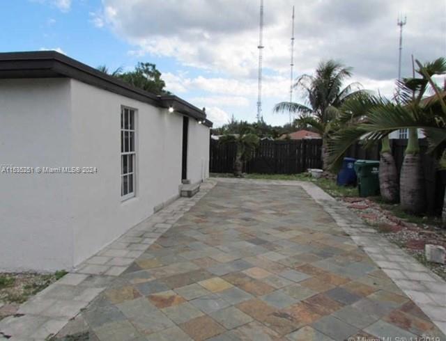 6111 Southwest 39th Street Miramar, FL 33023 - Photo 6 of 8 a view of a house with a backyard
