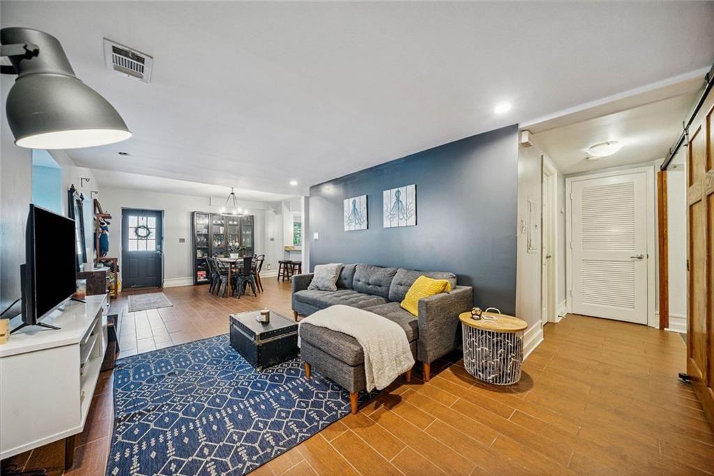 3048 Briarcliff Road Northeast, Unit 9 Atlanta, GA 30329 - Photo 12 of 30 a bedroom with two beds and a flat screen tv