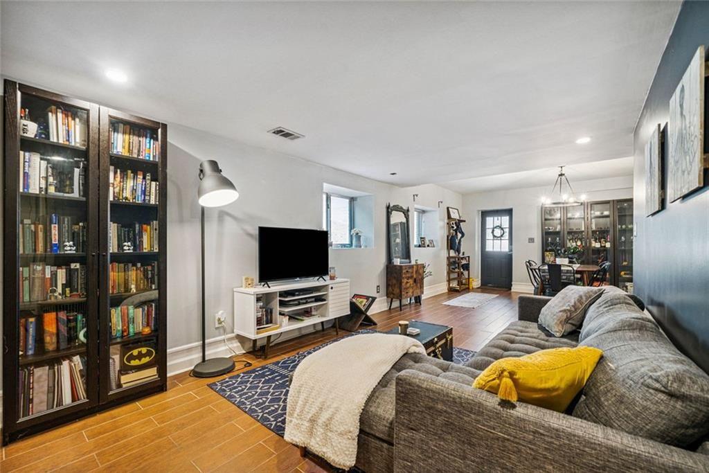 3048 Briarcliff Road Northeast, Unit 9 Atlanta, GA 30329 - Photo 13 of 30 a living room with furniture and a flat screen tv