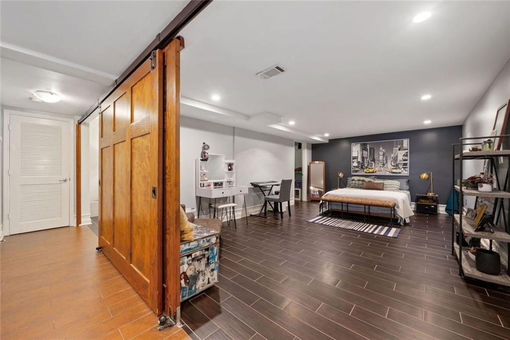3048 Briarcliff Road Northeast, Unit 9 Atlanta, GA 30329 - Photo 14 of 30 a bedroom with furniture and a large window