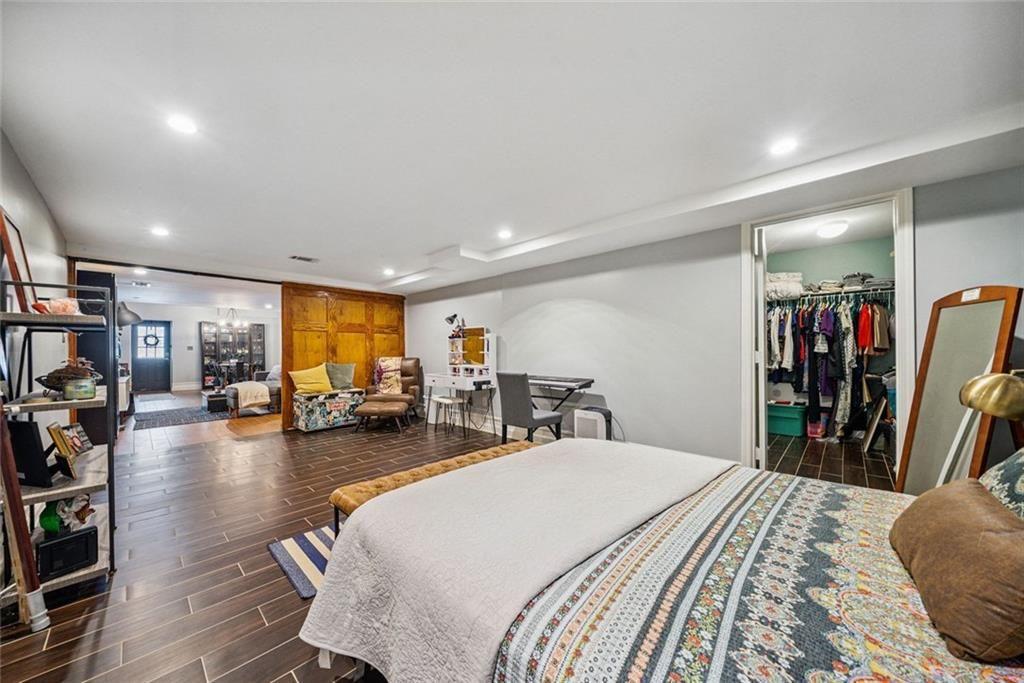 3048 Briarcliff Road Northeast, Unit 9 Atlanta, GA 30329 - Photo 16 of 30 a bed room with a bed and a large mirror